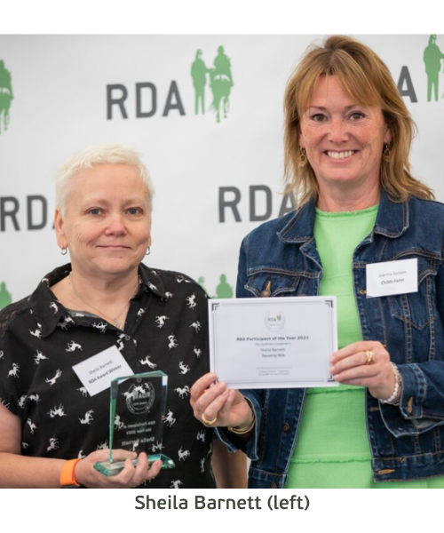 Two women proudly displaying an RDA award, symbolizing their achievement and recognition in their field. Sheila Barnett is on the left.