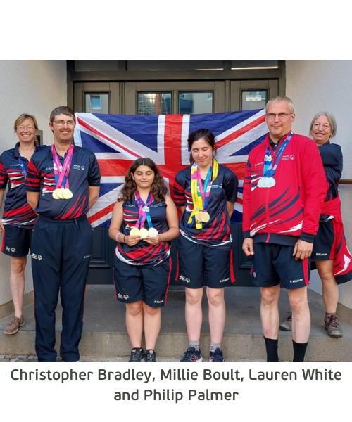 RDA riders a the Special Olympics. There are four people stood behind a Union Jack flag, holding their medals they won at the Special Olympics World Games.