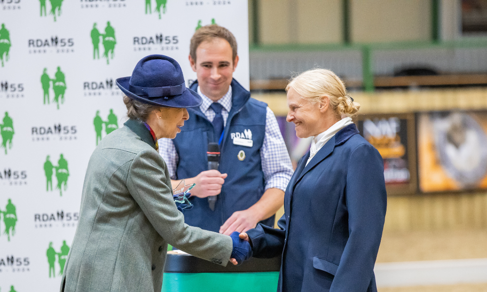 HRH, The Princess Royal presents Alison Riley from Helen Atkin Riding for The Disabled Group with her award for ‘RDA New Coach of the Year.’