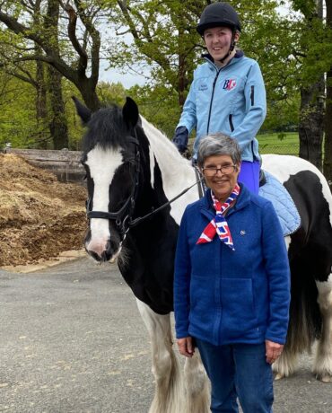 Sophie Lingfield and Deborah Hall at Chigwell RDA. Sophie sits on top of a piebald pony.