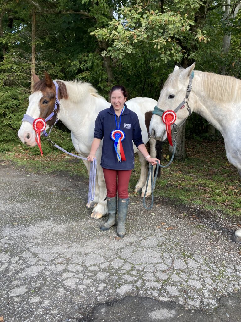 Millie holding two horses