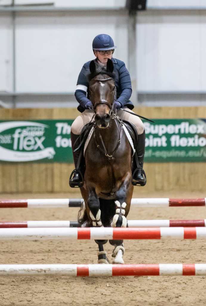 rider going over a show jump