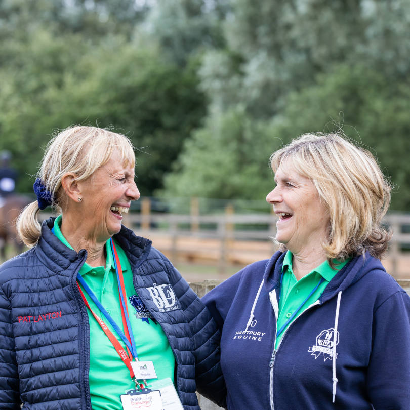 Two RDA volunteers laughing and smiling together