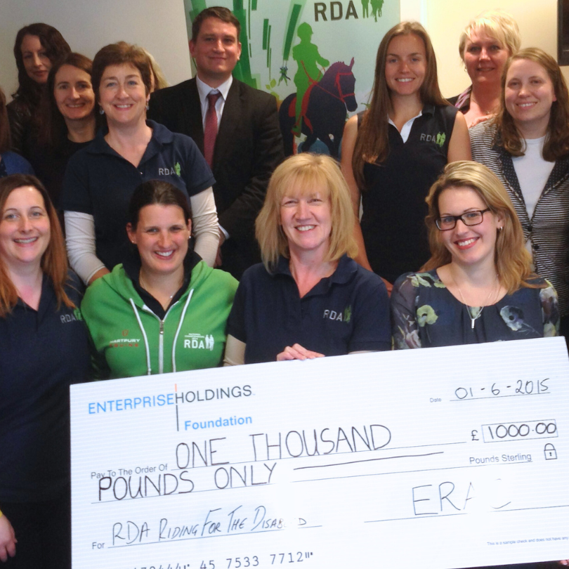 Image of fundraisers holding a large cheque