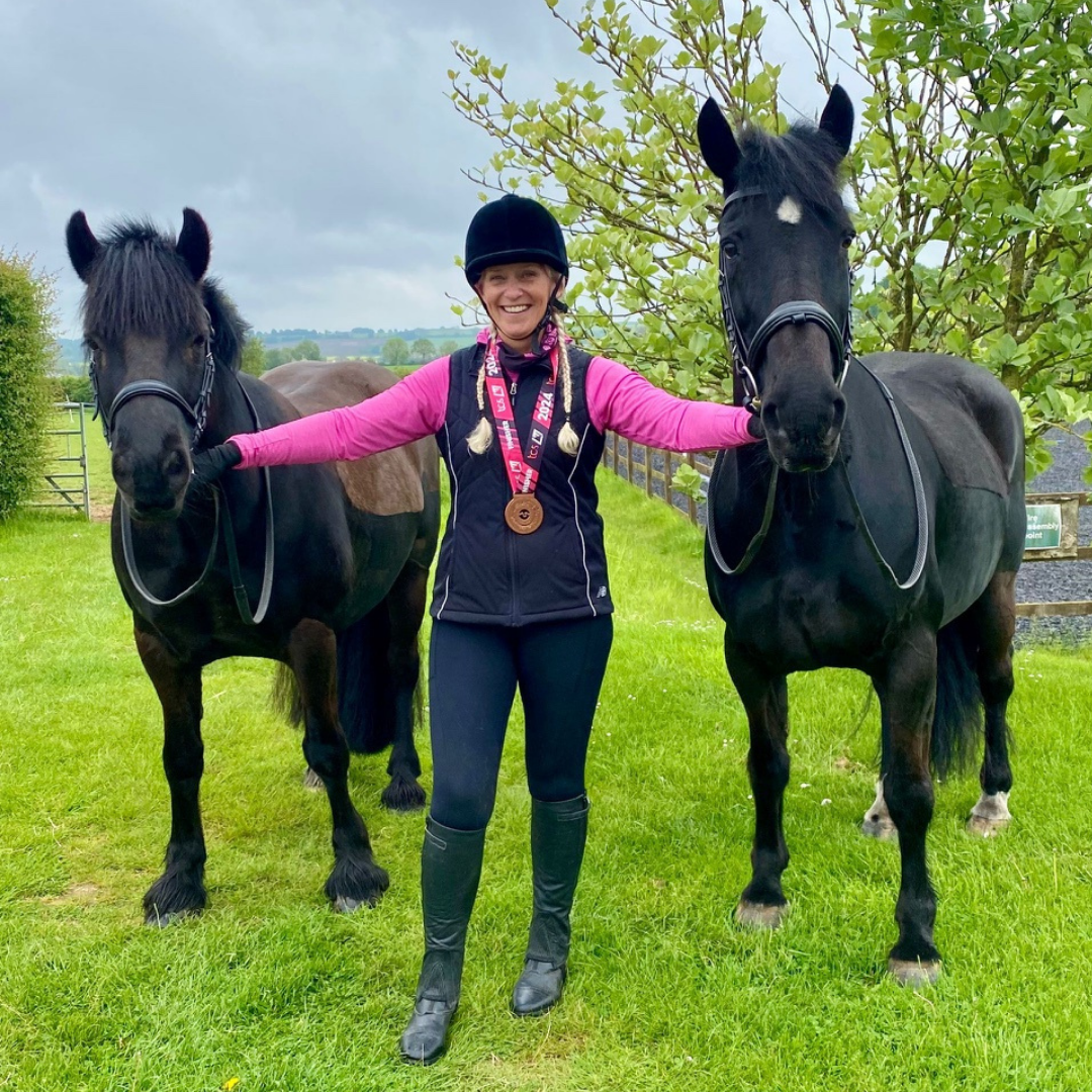 London Marathon participant with medal and her two horses