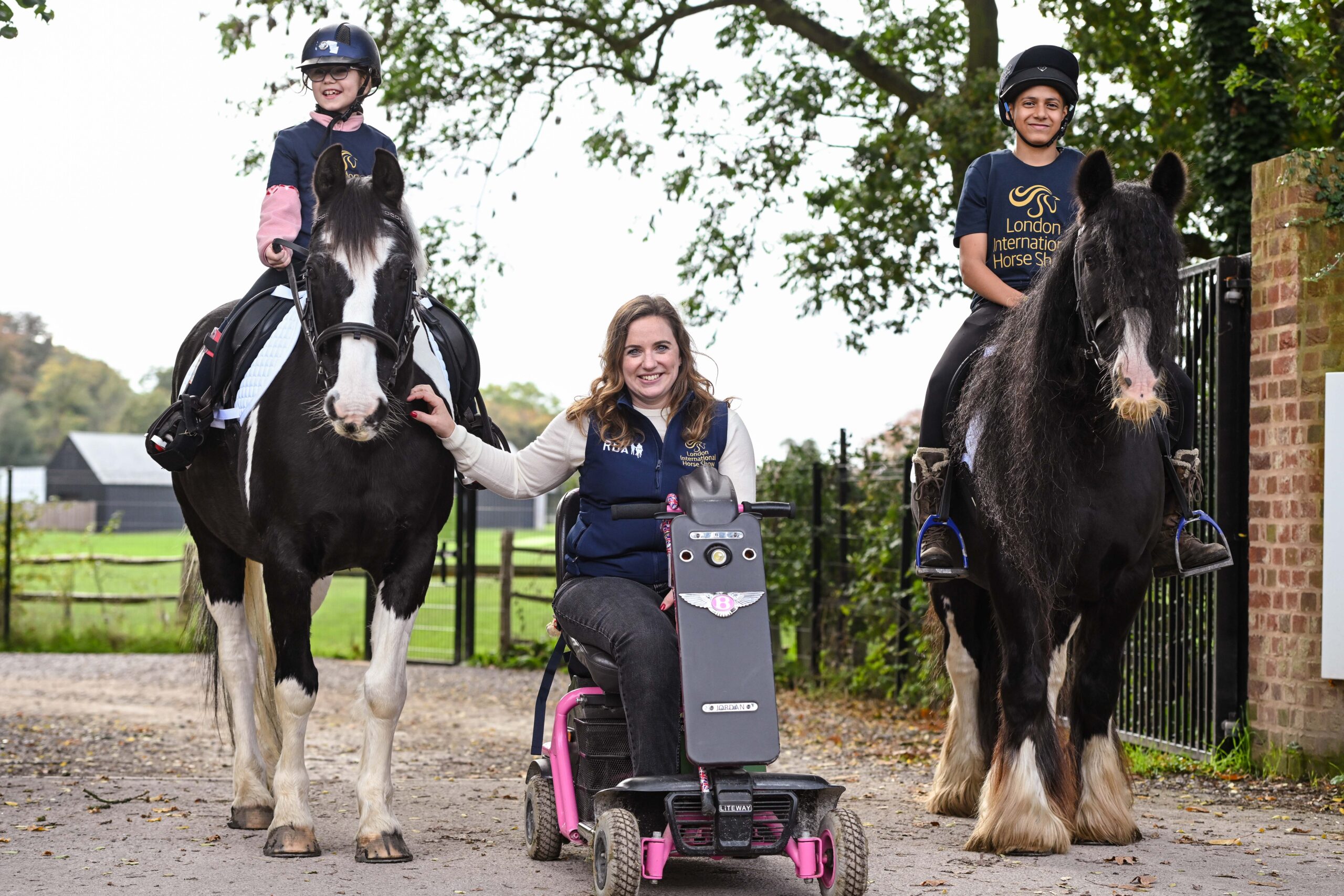 Natasha Baker with two RDA volunteer and participant