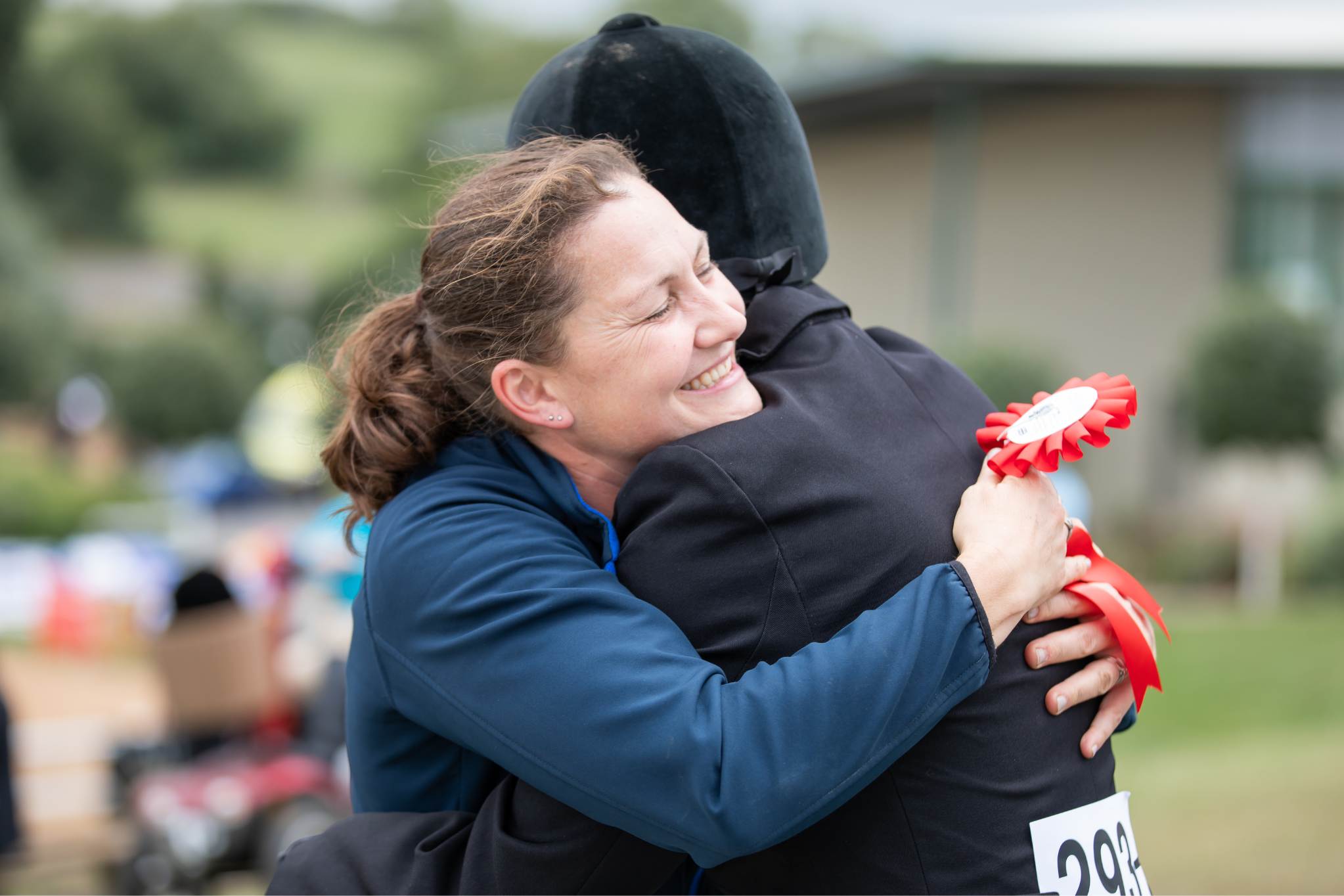 participant an parent hugging