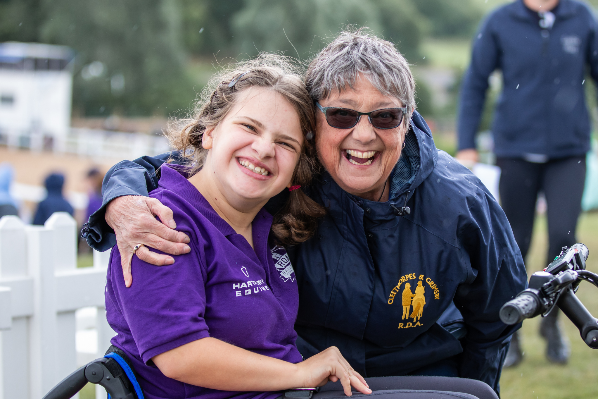 volunteer and coach smiling