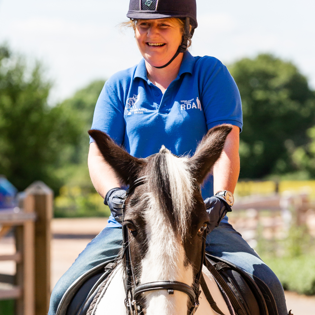 RDA participant riding on a black and white horse